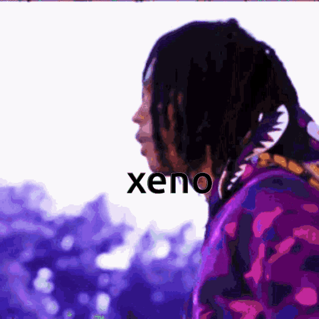 a man in a purple hoodie with the word xeno on the bottom