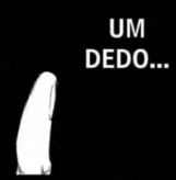a white penguin is standing in the dark with the words um dedo written on it .