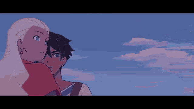a man and a woman are standing next to each other and looking up at the sky