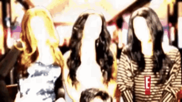 a group of mannequins are standing next to each other with their faces obscured
