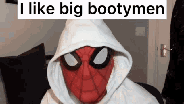 a man in a spiderman costume has a white hoodie over his head and says " i like big bootymen "