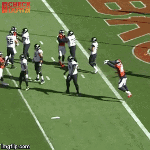 a group of football players on a field with the words check down on the bottom