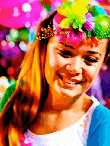 a woman with a flower crown on her head smiles for the camera
