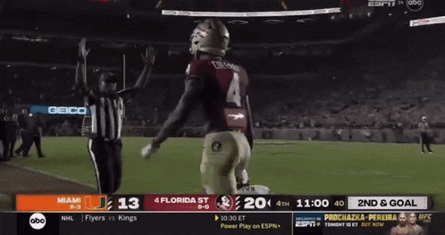 a football game is being played between miami and florida