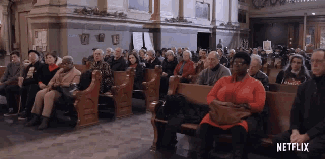 a group of people sitting in a church with a netflix logo on the bottom