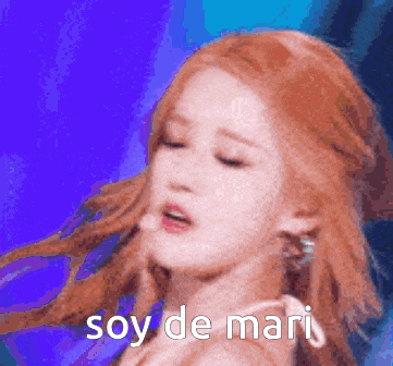 a close up of a woman 's face with the words soy de mari written below her