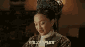 a woman in a traditional costume is talking in a room .
