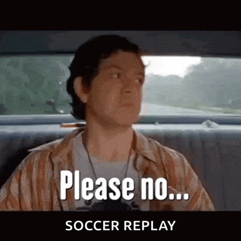 a man is sitting in the back seat of a car and saying please no soccer replay .