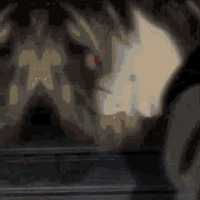 a blurry picture of a person standing in a dark room with a blurred background
