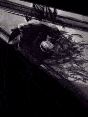 a black and white photo of a statue of a woman 's head .