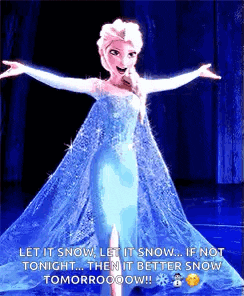 a picture of elsa from frozen standing on a stage with her arms outstretched .