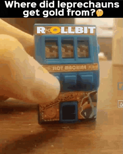 a person is holding a blue slot machine that says rollbit