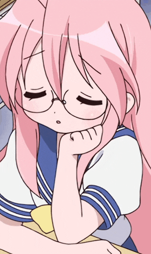 a girl with pink hair and glasses is sitting at a desk with her eyes closed