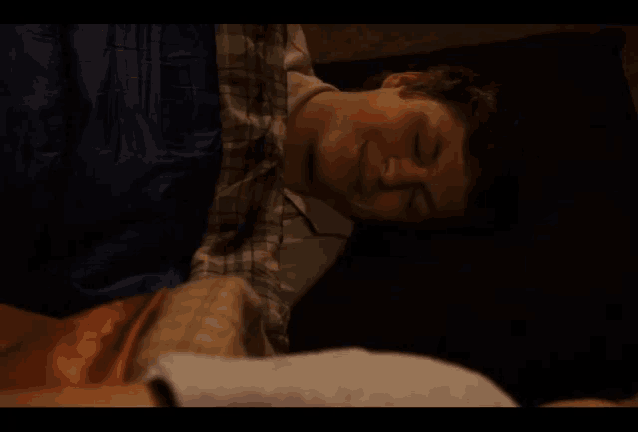 a man laying on a bed with the words i love you man