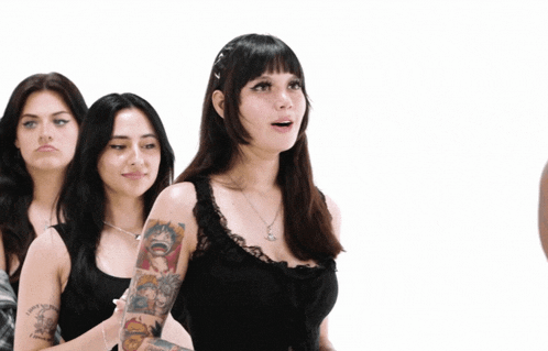 a woman with a tattoo on her arm that says " i am a princess "