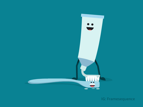 a tube of toothpaste is putting toothpaste on a blue toothbrush