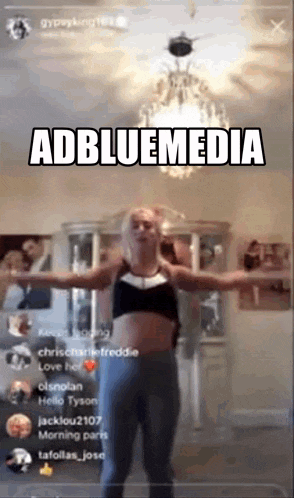 a woman is standing in a room with her arms outstretched and says adbluemedia