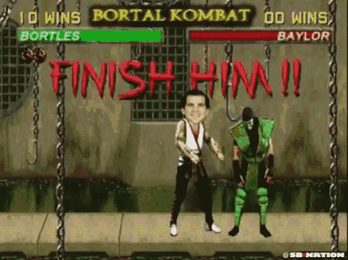 a video game with two fighters and the words finish him on the wall