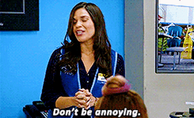 a woman in a blue vest says " do n't be annoying " to another woman