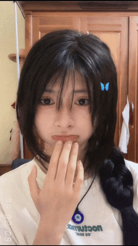 a girl wearing a white shirt with the word smutson on the front