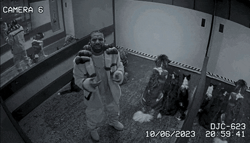 a black and white photo of a man standing in front of a camera with the date 10/06/2023