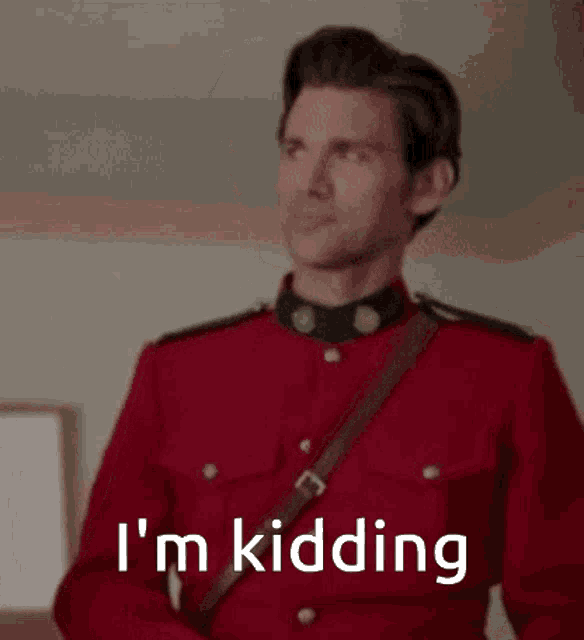 a man in a red uniform is saying i 'm kidding