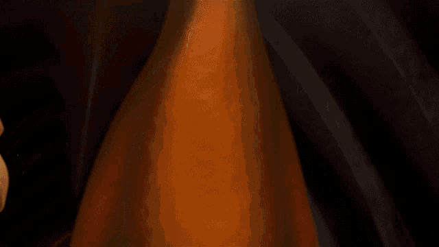 two cartoon characters are covering their faces with their hands in a dark room
