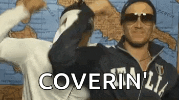two men are standing next to each other and one of them is wearing sunglasses and a mask .