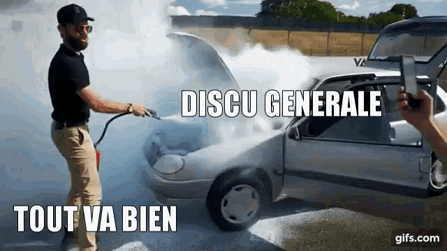 a man is standing next to a car with the hood open and smoke coming out of the engine ..