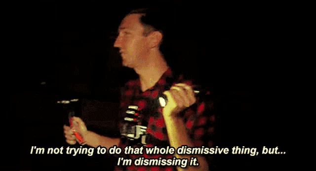 a man is holding a flashlight and saying i 'm not trying