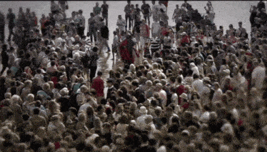 a large crowd of people are gathered in a large area