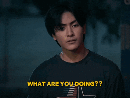 a young man in a black shirt is asking what he is doing