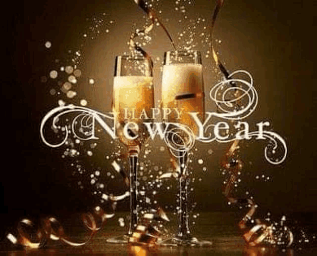 two glasses of champagne are being poured with the words `` happy new year '' written on them .