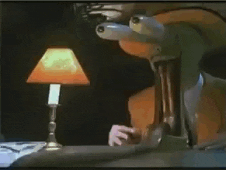 a lamp is lit up in a dark room