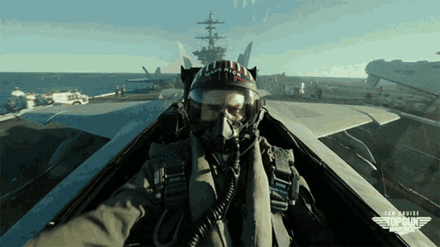 a man wearing a helmet that says navy on it