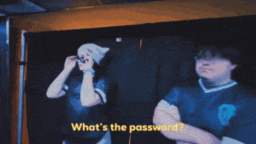 a group of men are standing in a hallway and one of them is wearing a shirt that says ' nc '