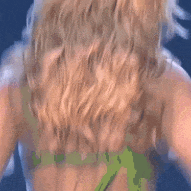 a close up of a woman 's hair with a blurry background .