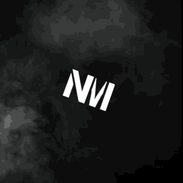 the letter n is surrounded by smoke in a black background
