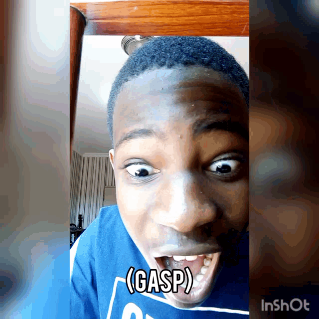 a man in a blue shirt is making a funny face and gasp is written on his face