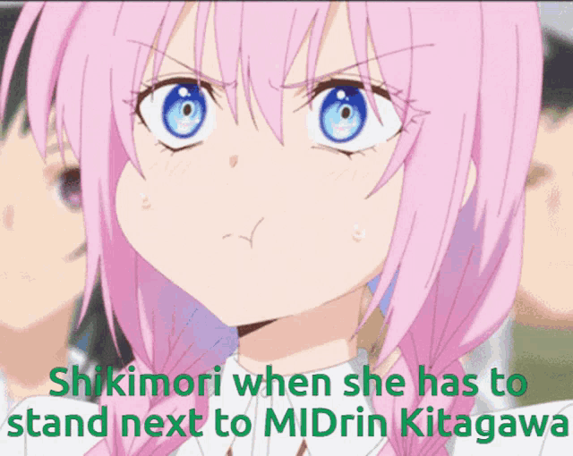 a girl with pink hair and blue eyes is making a funny face