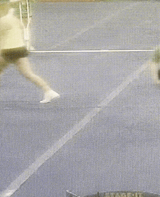 a blurred image of a person walking on a track