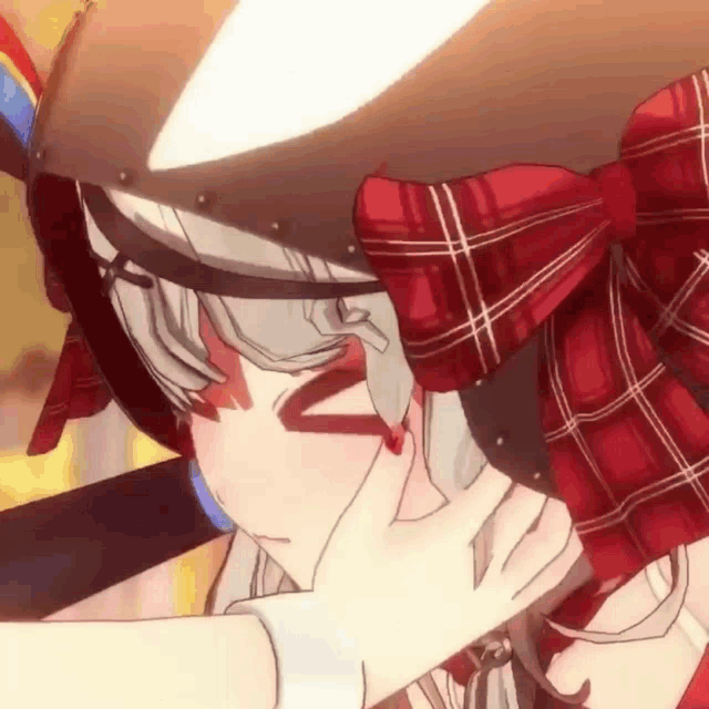 a close up of a person touching a girl 's face with their hand .