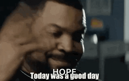 a close up of a man 's face with the words `` hope today was a good day '' .