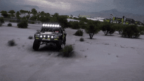 a traxxas off road vehicle is driving through the desert