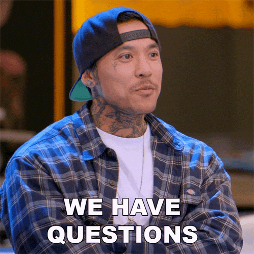 a man wearing a hat and plaid shirt says we have questions