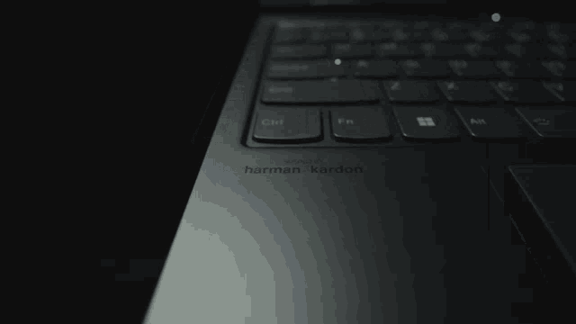 a harman kardon laptop with a black keyboard