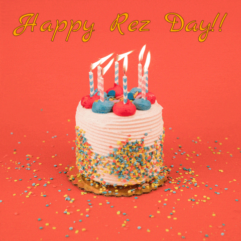 a birthday cake with lit candles and sprinkles and the words happy rez day
