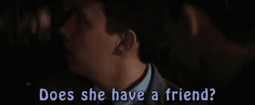 a young boy is talking to a man and the words does she have a friend are visible .