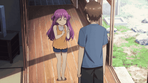 a boy and a girl are standing next to each other on a wooden floor