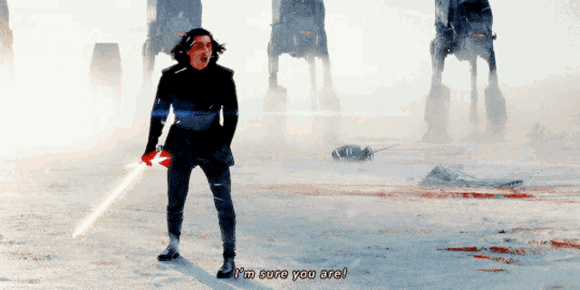 a man holding a lightsaber says i 'm sure you are in front of at at walkers